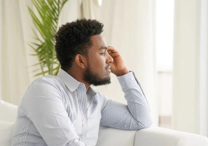 A person sitting quietly, reflecting during recovery
