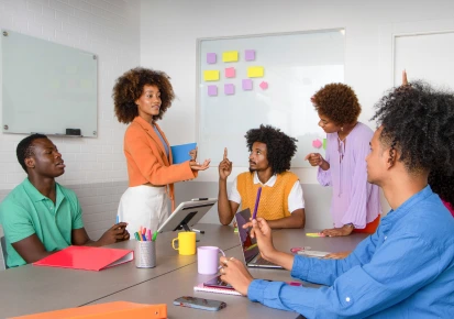 A team collaborating in a workplace wellness workshop